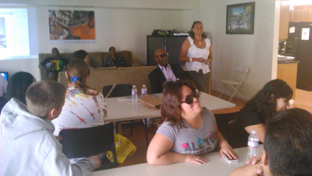 Maria gives a presentation to Los Angeles blind students with Lynn sitting among the group