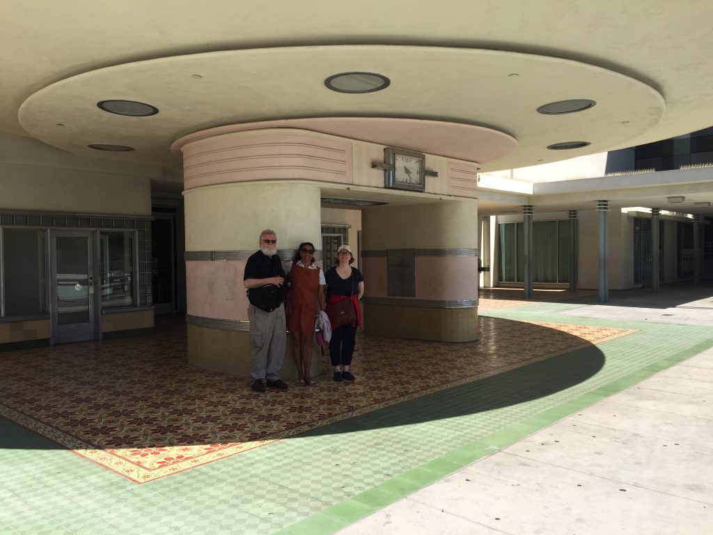 Maria and Terry and Gabi Braun, standing in front of the old Ambassadors Hotel/Coconut Grove.